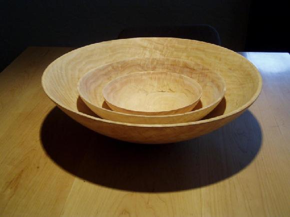 Here is what a series of bowls looks like. There are coring systems available that make it possible to cut more bowls from a blank with less wear and tear. The only trouble is, the systems cut radius only since they are hinged from a single point on the tool. I like that my bowls are not so uniform.